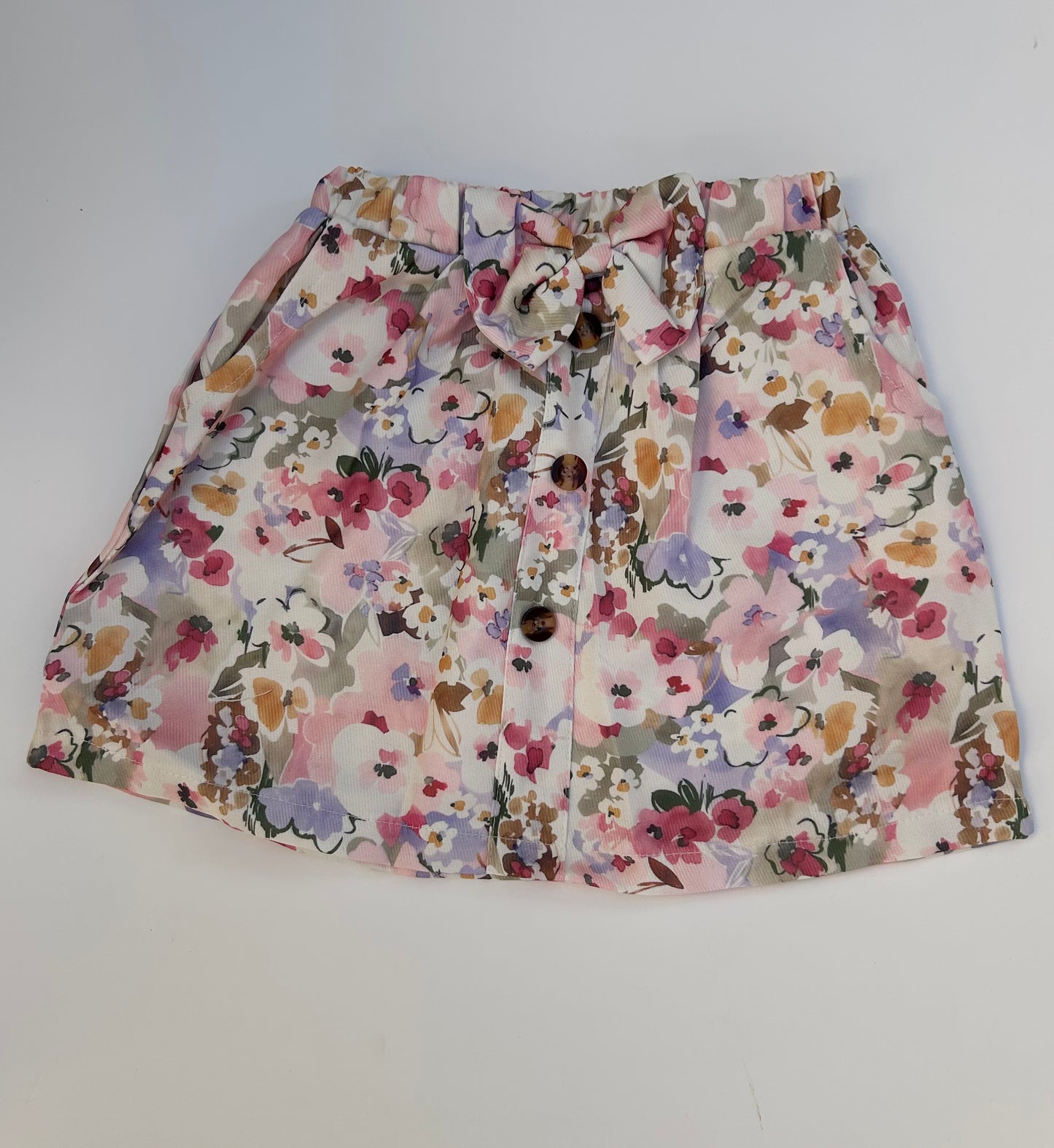 IM baby pink top with flowery skirt