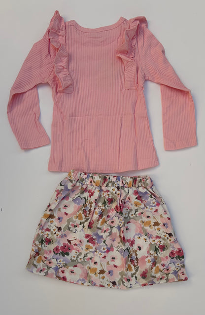 IM baby pink top with flowery skirt